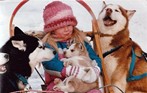 Melissa holding Albert and watched by her team. -Toronto Sun